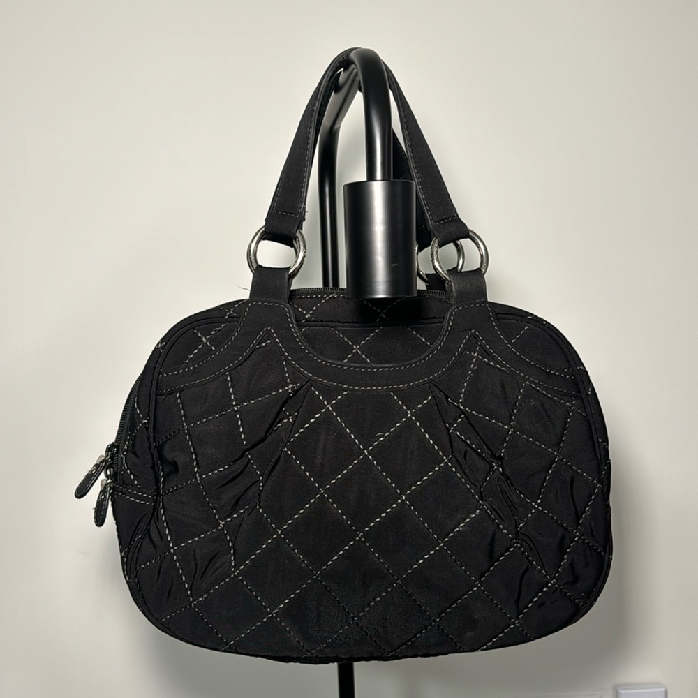 Vintage quilted footed handle bag